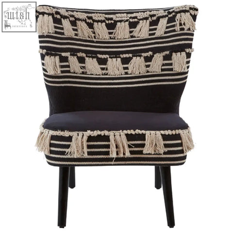 Cefena black moroccan chair with black and cream stripes and tassels on a cozy armchair design