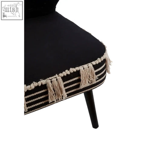 Cefena black moroccan chair with black upholstery cream fringe and striped trim along the seat edge