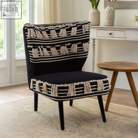 Cefena black moroccan chair with black upholstery white stripes and cream tassels on backrest seat and sides