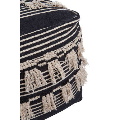 Cefen a black pouffe with black and white stripes and cream-colored tassels perfect as a cozy footrest