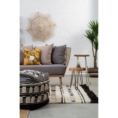 Black and white striped pouf with tassel trim in cefena black pouffe perfect for stylish seating and decor