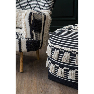 A black and white woven cefena black pouffe with fringe detailing perfect as a stylish black pouffe seat
