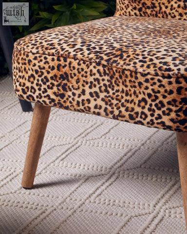 Cefena leopard print velvet chair with wooden legs and soft leopard print upholstery perfect for stylish seating
