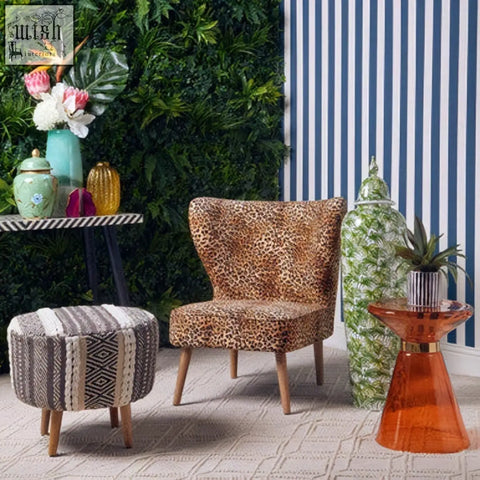 Leopard print velvet single chair with wooden legs and sleek fine frame in natural wood color