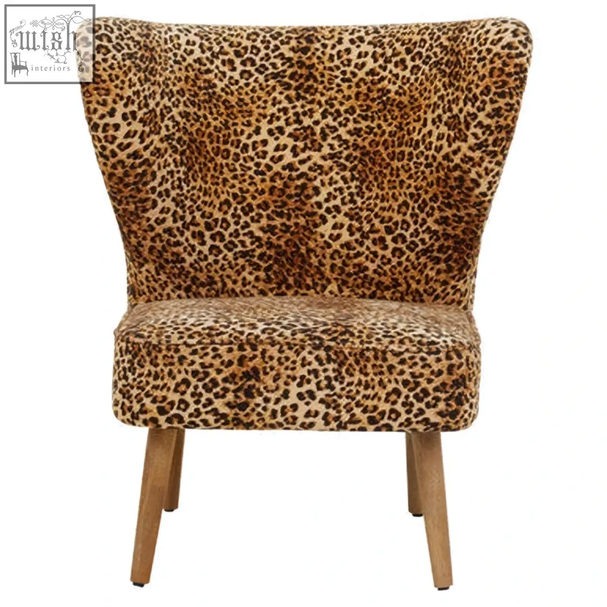 A cefena leopard print velvet armchair with a curved back and wooden legs perfect for cozy seating