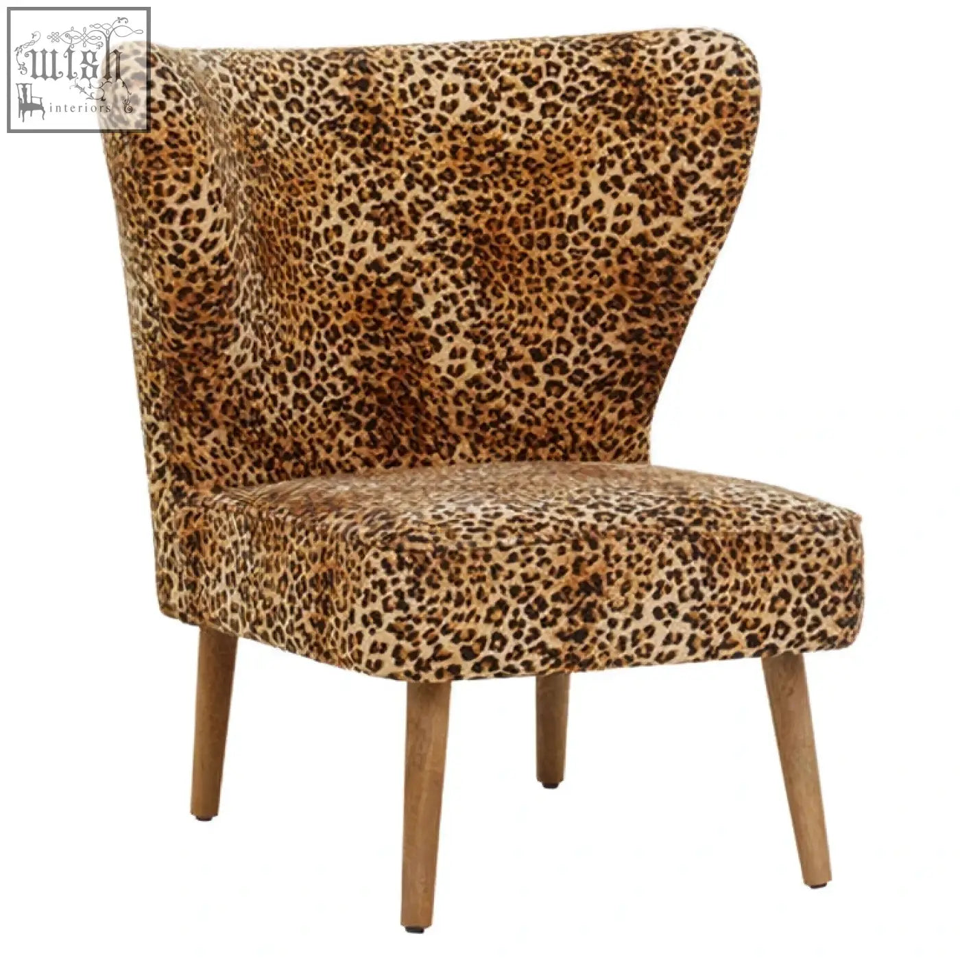 A stylish cefena armchair with bold leopard print velvet upholstery and wooden legs perfect for chic living spaces
