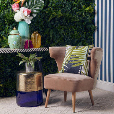 Beige cefena mink velvet armchair with wooden legs and tropical leaf natural linen cushion for cozy seating