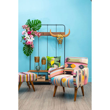 A vibrant cefena fabric chair with bold geometric pattern and mango wood legs for stylish seating