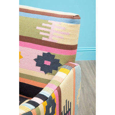 A vibrant multicoloured fabric chair with bold geometric patterns and mango wood legs for stylish seating