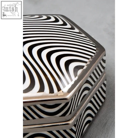 Celeste small trinket box is a black and white wavy striped ceramic small trinket box with a silver metallic rim