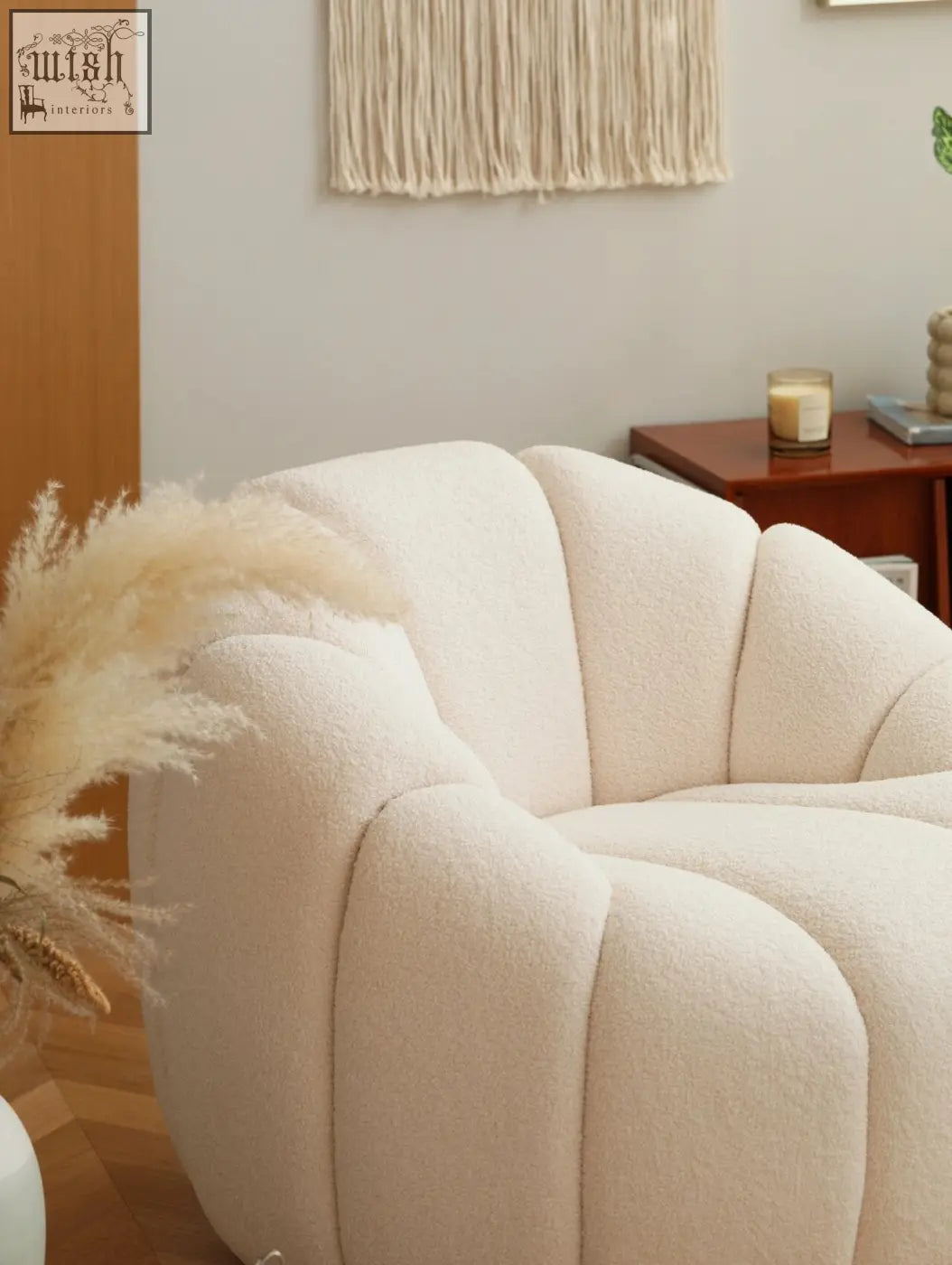 Creline pumpkin round armchair in cream bouclé with plush shell-like design and cozy upholstered round armchair style