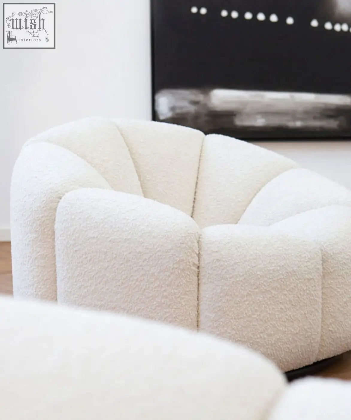 Cream-colored plush pumpkin round armchair in white boucle with a modern sculptural segmented design