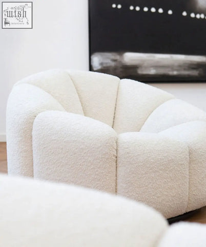 Cream-colored plush pumpkin round armchair in white boucle with a modern sculptural segmented design