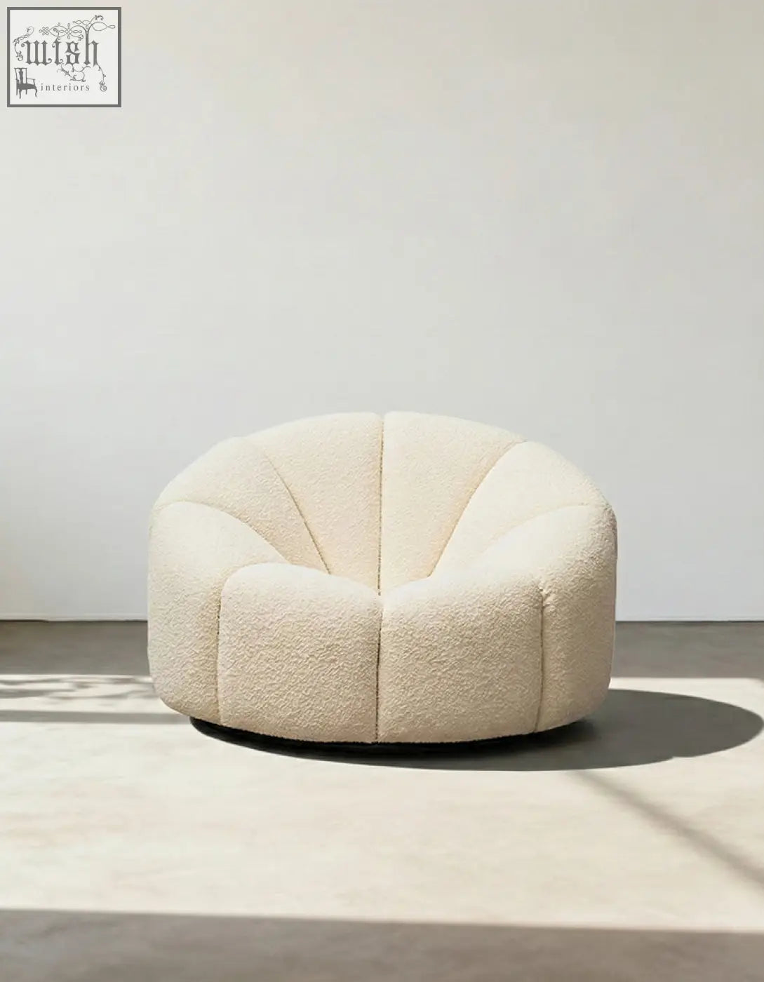 Cream-colored plush shell-shaped pumpkin round armchair in soft white boucle fabric for cozy seating