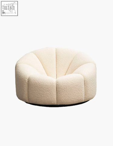 Cream-colored pumpkin round armchair in soft white boucle fabric with plush shell-shaped design and cozy texture