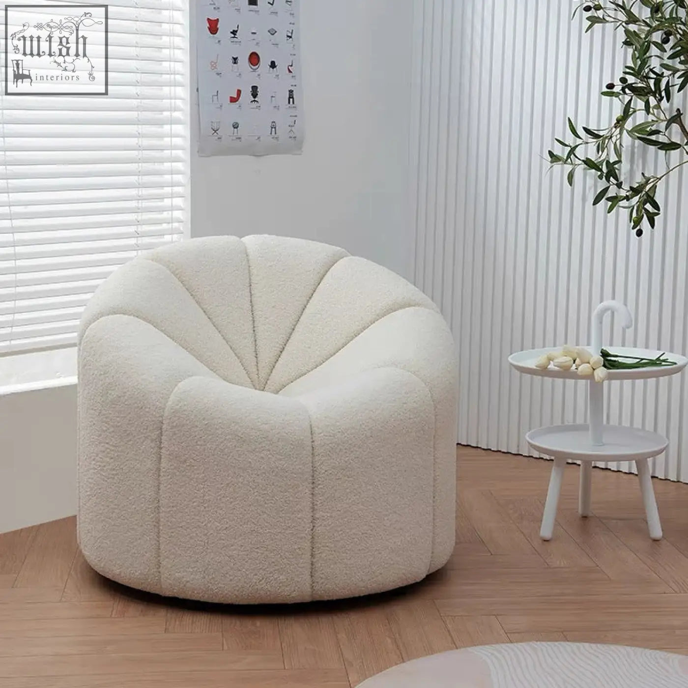 Cream-colored plush pumpkin round armchair with soft textured white boucle fabric and shell-shaped design