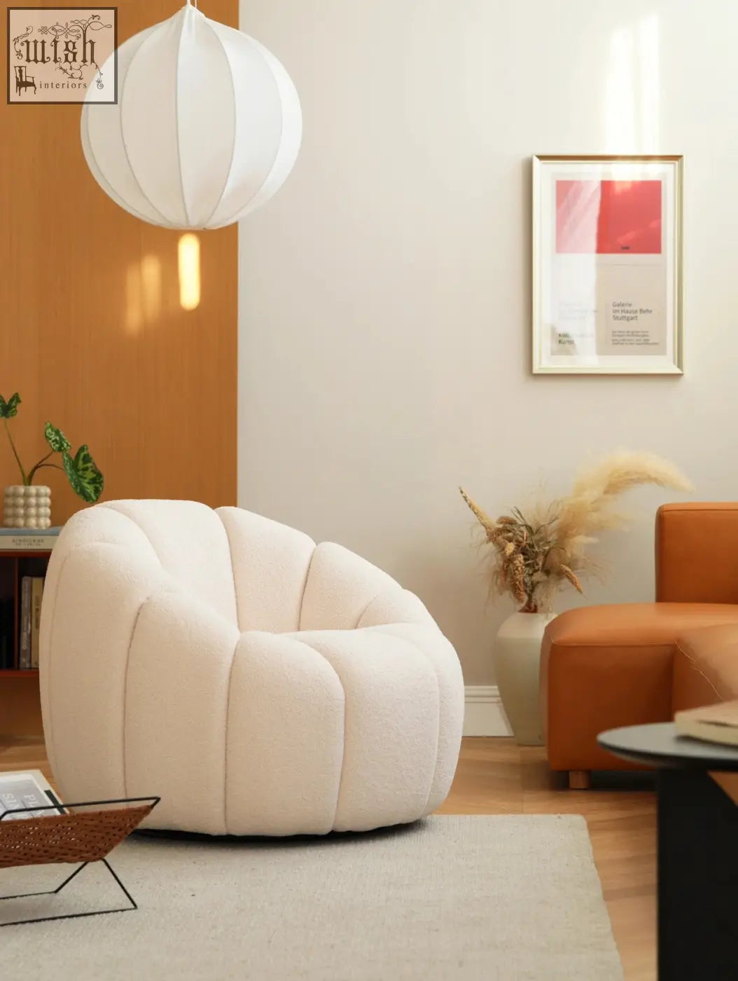 Cream-colored plush pumpkin round armchair in white boucle with soft segmented fabric design perfect for cozy spaces