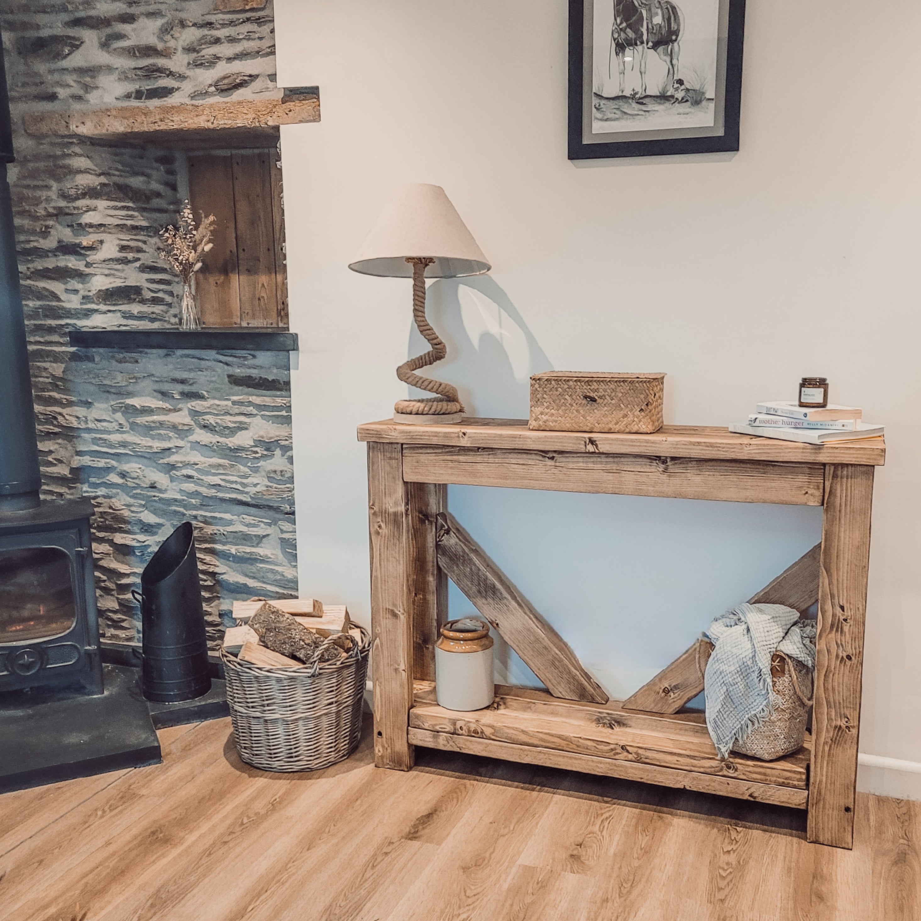 Rustic wooden cera console table with natural finish and distinctive diagonal v back support beams