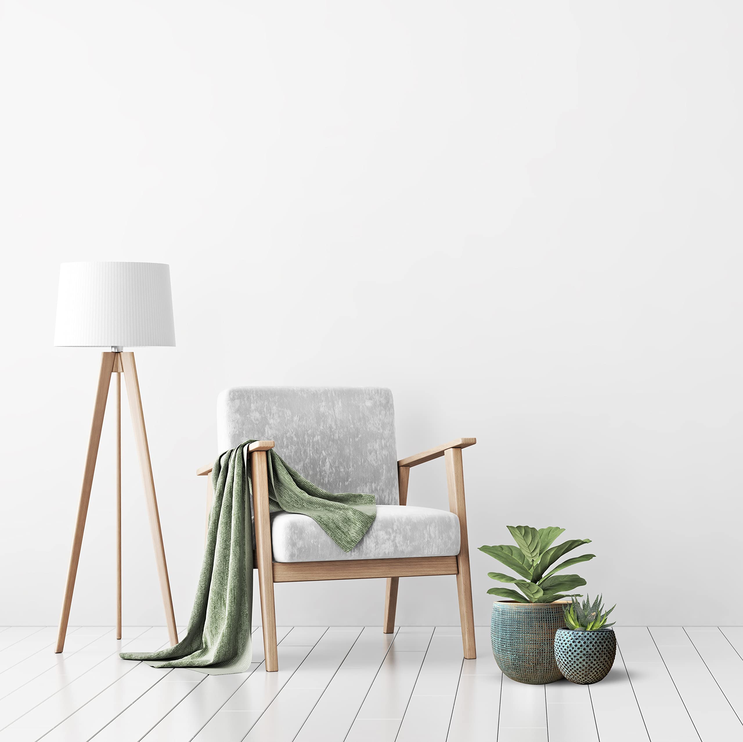 Modern wooden armchair with gray fabric seat and olive green throw beside ceramic green gold plant pot set for indoor use