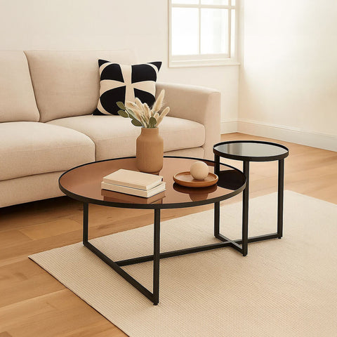 Modern black metal-framed nesting tier coffee tables with round smoked mirror glass tops for living room use