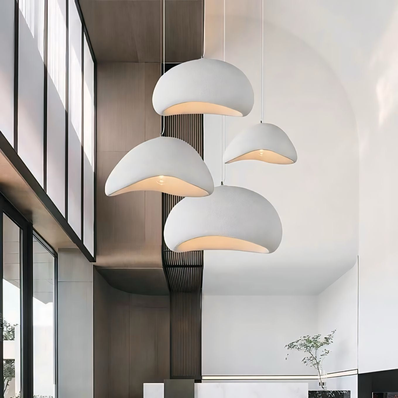Modern white ceramic chandan light pendant lights with smooth dome shape and warm glowing interior