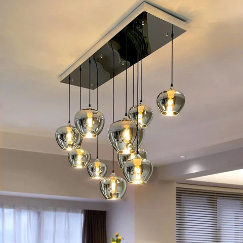 Modern chrome pendant chandelier with multiple glass globes for dining room lighting in warm white and cold white options