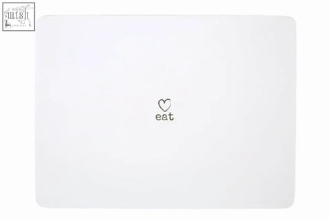 White rectangular placemat from charm set of four placemats with small black heart and eat printed below
