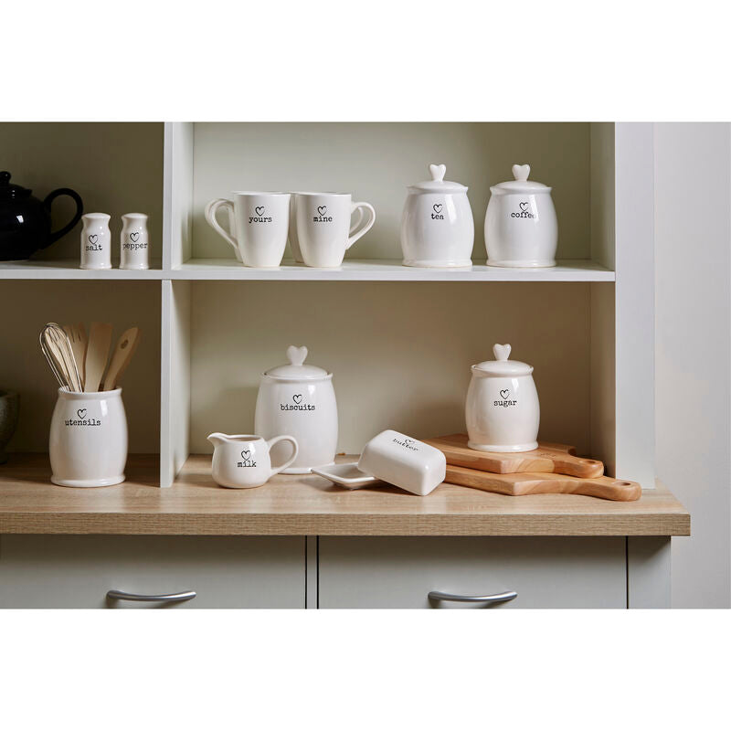 White dolomite sugar canister set with heart-shaped lids and black printed labels for charming kitchen storage