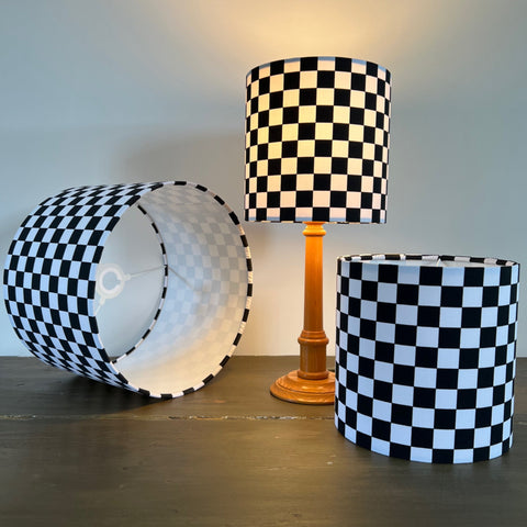 Black and white checkerboard cotton drum lampshade with wooden base 30cm height and white lining ceiling shade