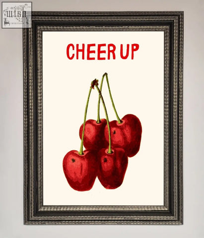 Cheer up cherries framed wall art with glossy red cherries and bold red text on off-white background in a classic frame