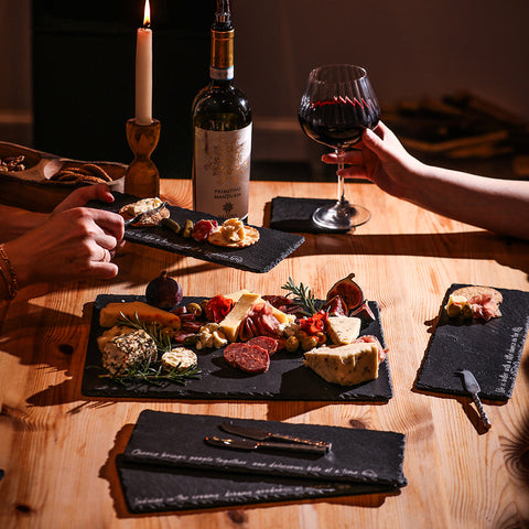 Black mini slate cheese board with assorted cheeses meats and garnishes perfect for cheese sayings set of 4
