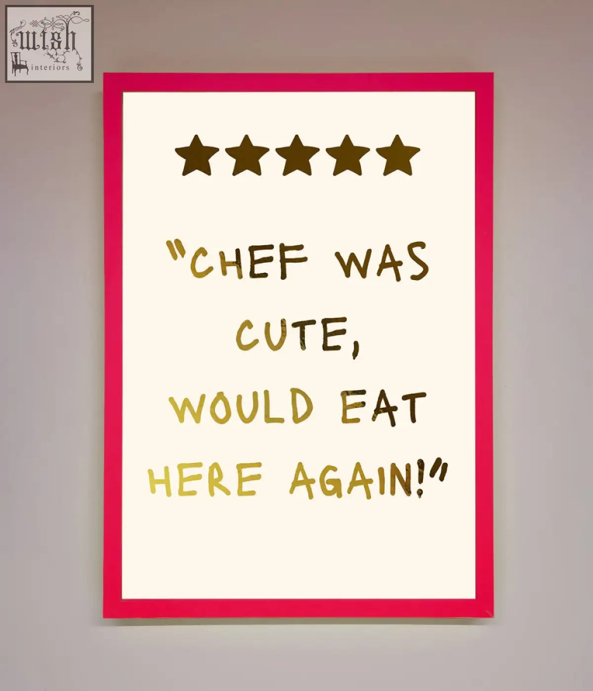 Framed chef was cute foil print with vibrant pink border and bold gold handwritten text on off-white background
