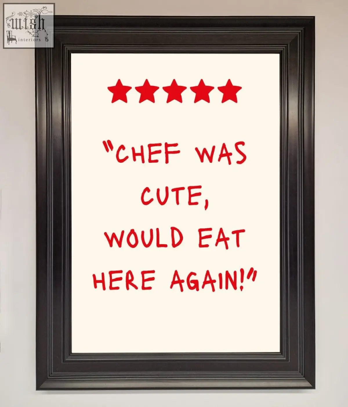 Black-framed cute framed wall art with red handwritten text and five stars on a cream background for kitchen decor