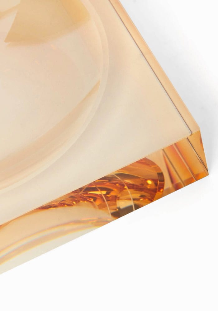 Chelsea amber glass trinket tray in translucent amber acrylic with smooth curves and sharp corners for stylish storage