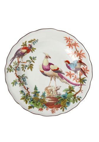 A delicate white porcelain chelsea bird side plate with vibrant purple blue green and orange bird and foliage design