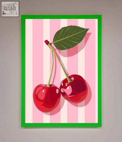 A vibrant green-framed print with two glossy red cherries and a leaf on a pink and white stripes framed background