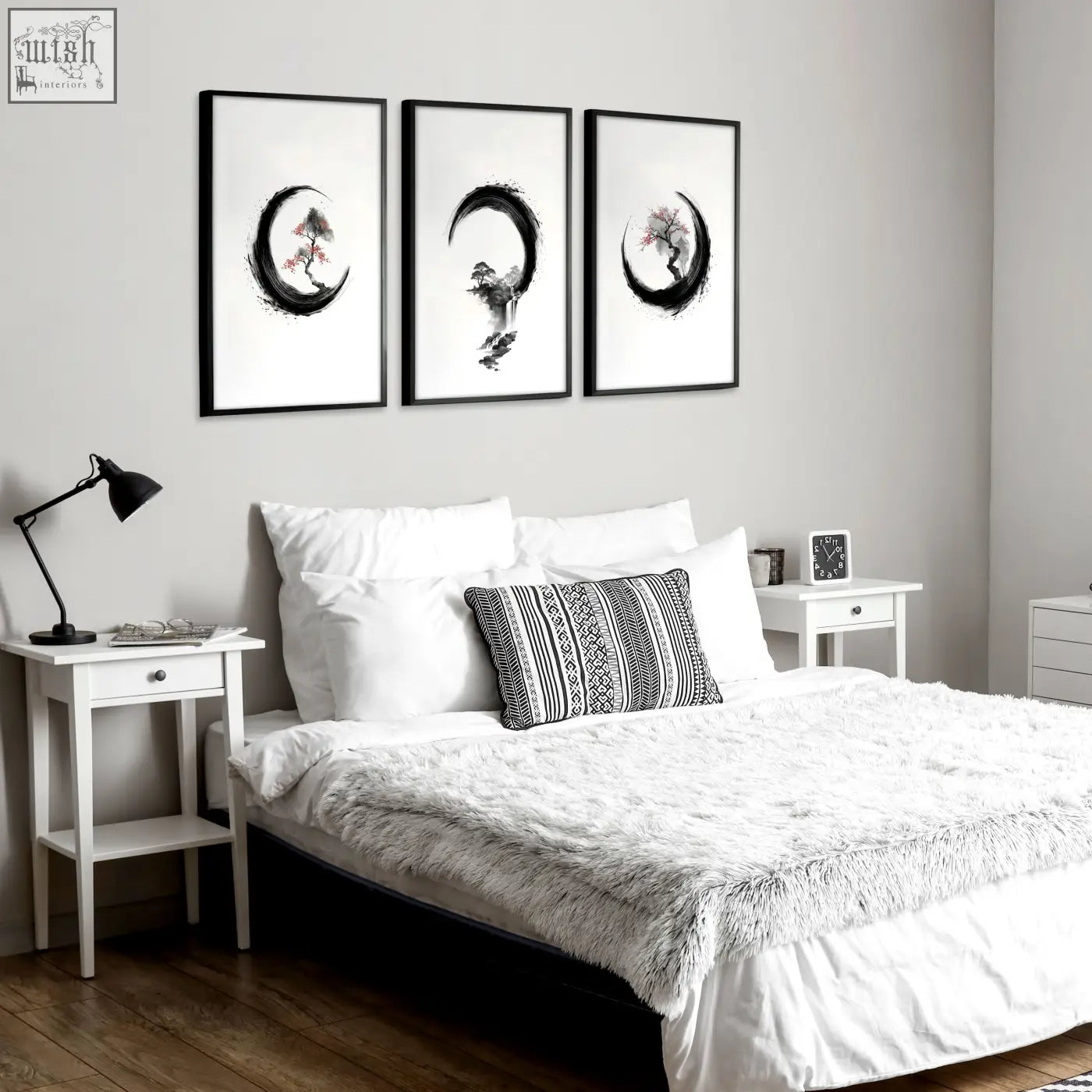 Three framed black-and-white cherry blossom paintings with ink art trees in crescent shapes above a bed set of 3