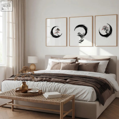 Beige upholstered bed with layered white and brown bedding next to cherry blossom painting japandi enso circle ink art set of 3