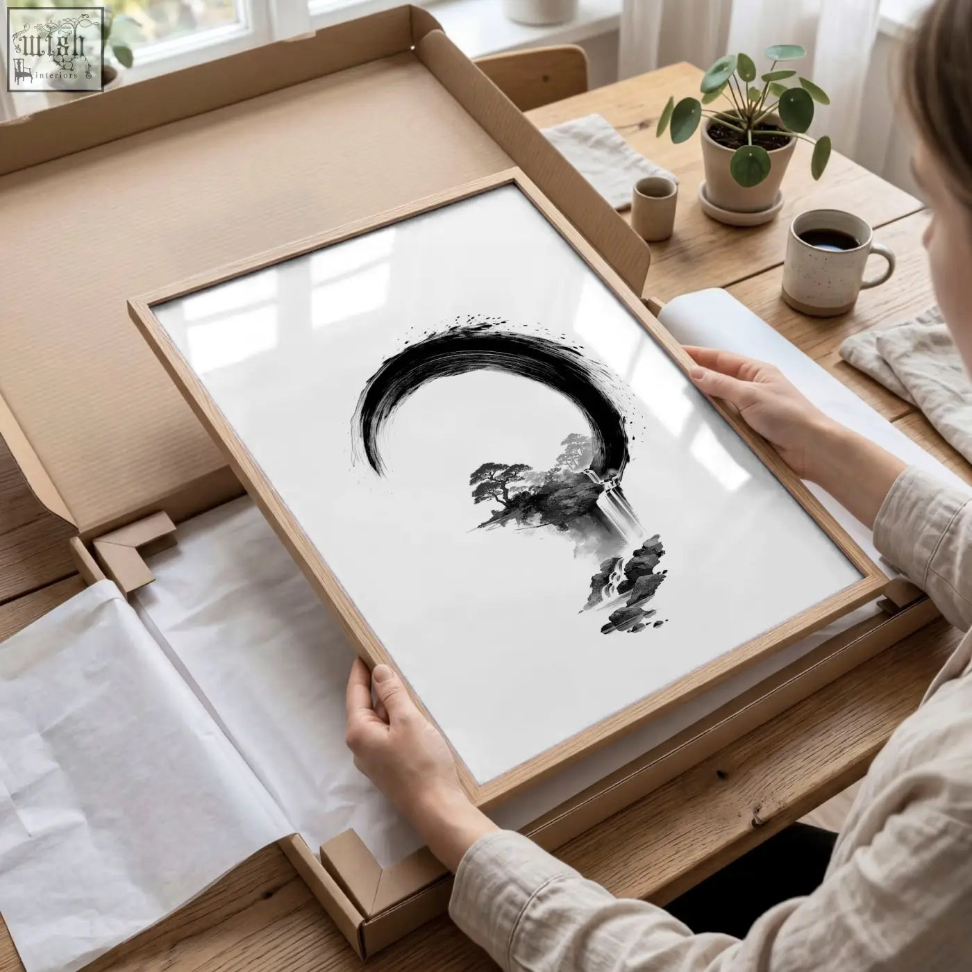 Minimalist cherry blossom painting featuring black ink brushstroke crescent and trees in light wood frame for japandi decor