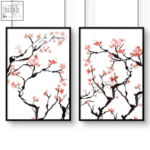 Two black-framed wall art prints featuring delicate pink cherry blossom branches on white background for cherry blossom wall decor