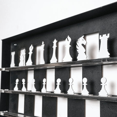 White chess pieces on a modern black and white checkered shelf showing two squares in a chess wall game setup