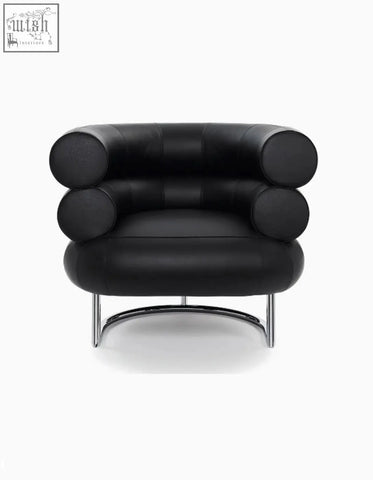 Black leather chester armchair with cylindrical rolled arms and chrome curved legs for stylish seating