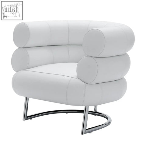 White leather chester armchair with cylindrical stacked cushioning and sleek chrome base for modern living spaces