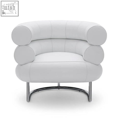White leather chester armchair with rounded segmented cushions and chrome curved legs for stylish seating
