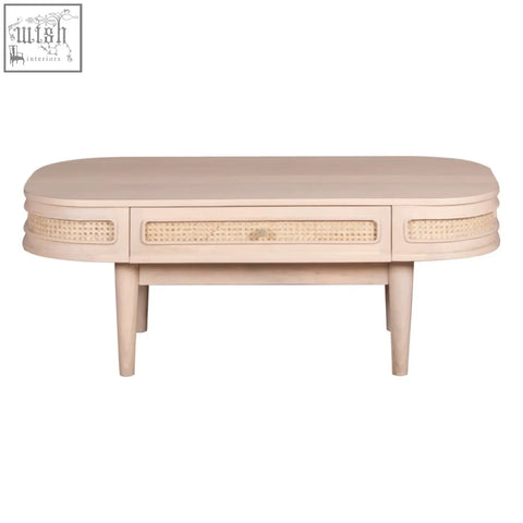 Beige oval chester cane and wood coffee table with woven cane accents and 1 drawer made from natural materials