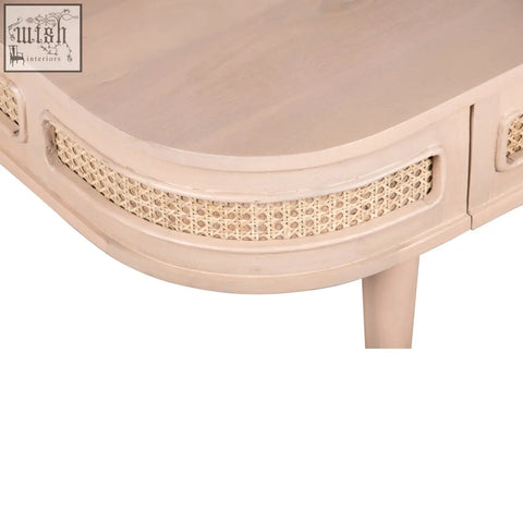 Beige wooden coffee table with woven cane accents along curved edge featuring natural materials and one drawer design