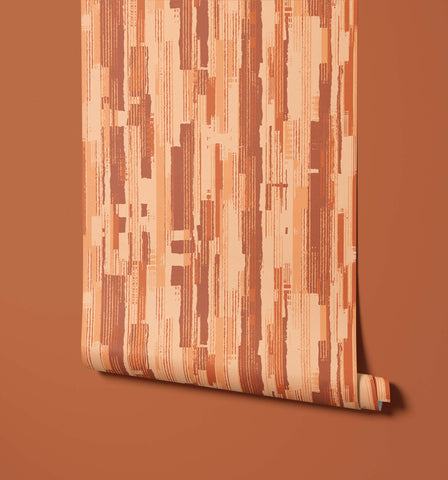 A roll of chester terracotta wallpaper with a modern abstract pattern of vertical stripes in orange beige and brown