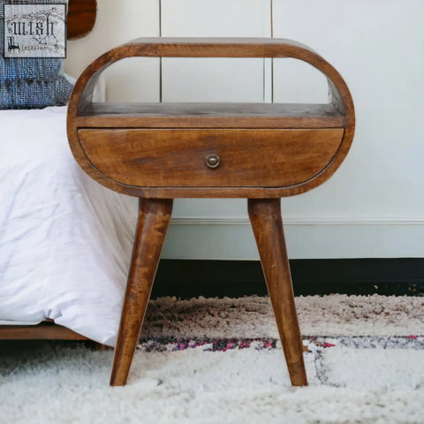 Mid-century modern wooden nightstand with curved top single drawer and tapered legs in warm chestnut finish