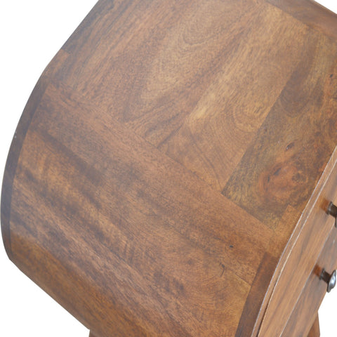 Curved wooden chestnut circular bedside table with warm rich brown finish and natural wood grain patterns