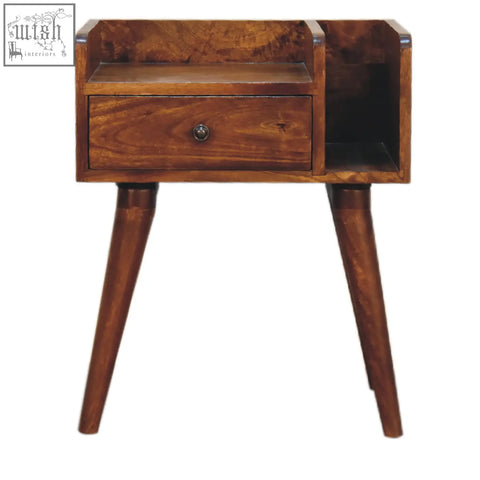 A warm brown wooden chestnut collective bedside table with angled legs, small drawer, and open slot for storage